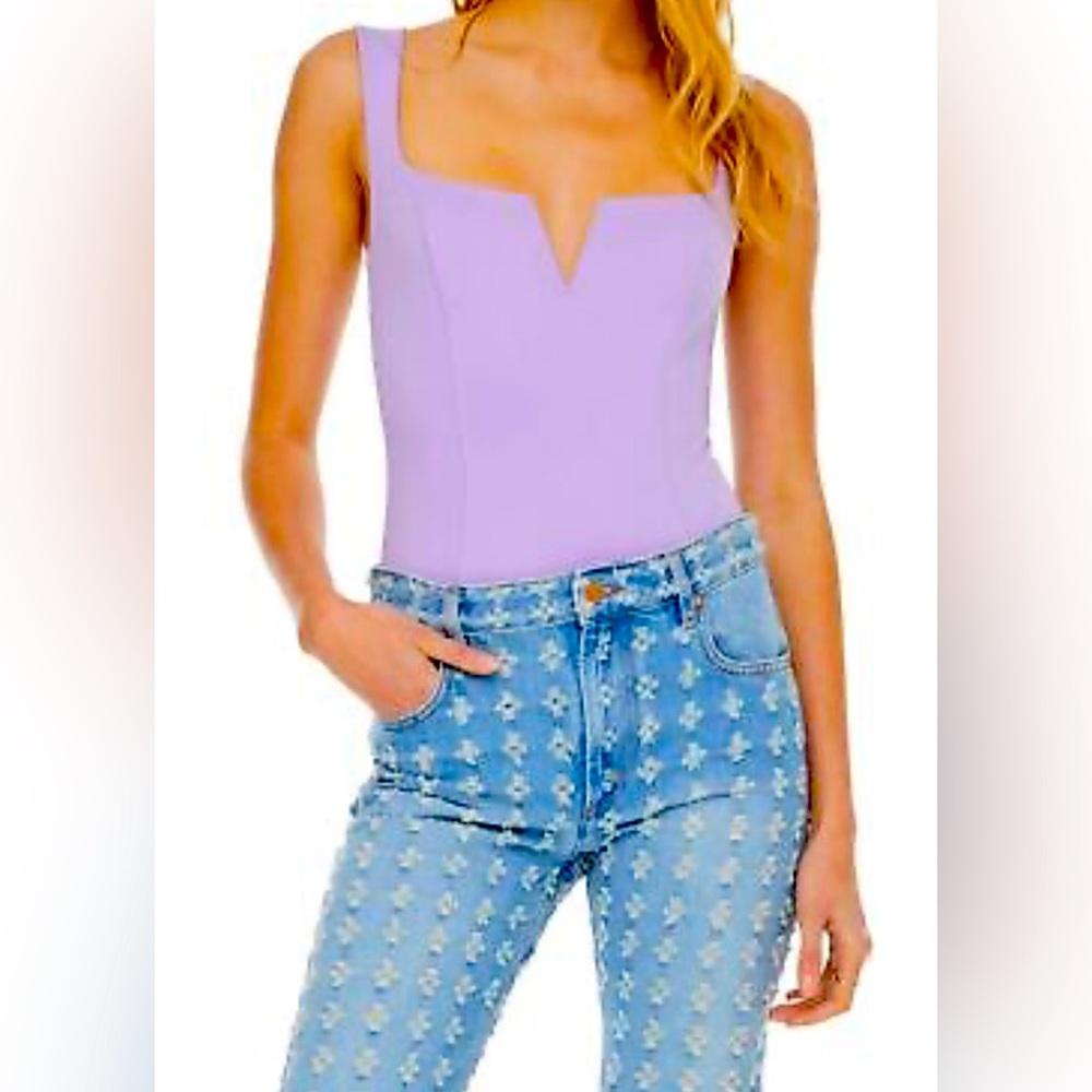 Purchased from Bloomingdale’s New with Tags purple bodysuit, size M